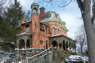 fyf_culturalattractions_w Three-quarter view of Harry Packer Mansion, Jim Thorpe, PA in winter with snow around building.