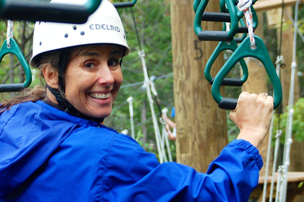 Woman in blue jacket ziplining