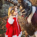 Little girl and Krampus character