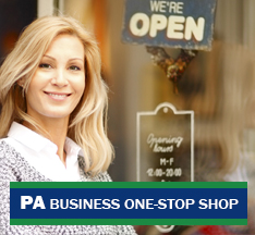 Woman in front of open business window sign