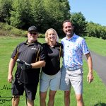 Two male golfers and one female golfer