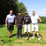 Four male golfers who won the golf tournament