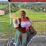 oktoberfest 22 german barmaid smiling and holding beer stein