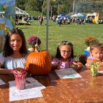 oktoberfest 22 kids doing crafts with pumpkin on table