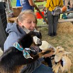 oktoberfest22 woman feeding two goats