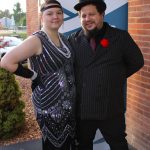 Flapper woman and man in black with bowler hat