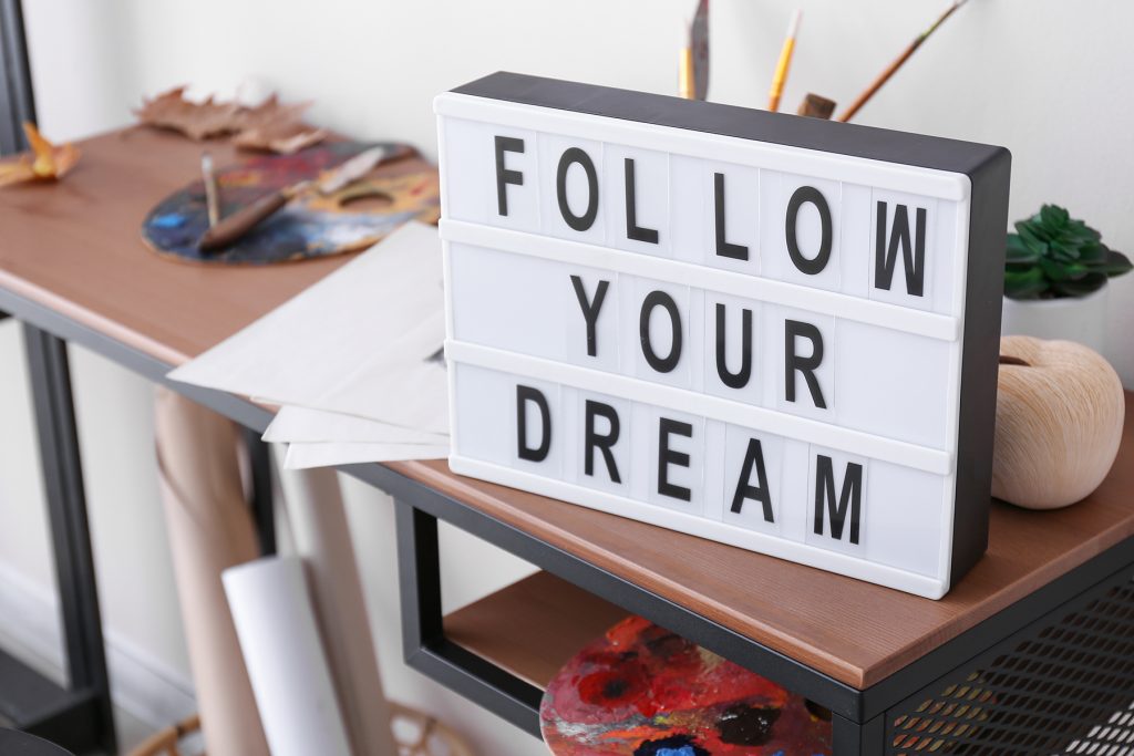 Follow your dream sign on desk