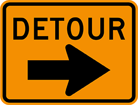 yellow detour sign with arrow