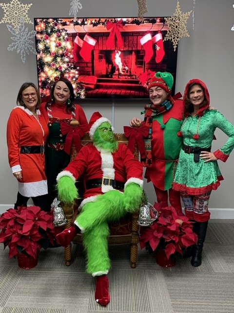 Nancy Turner, Erika O'Brien, The Grinch, Ryan Case, and Cindy Banks host a Chamber Breakfast