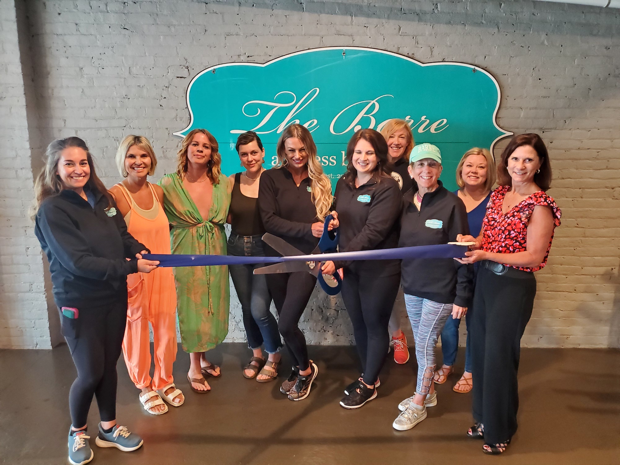 Shalanta Gullett and Jessica Chamberlain cut the ribbon together, celebrating The Barre: A Fitness Boutique membership into the Winchester-Clark County Chamber of Commerce.