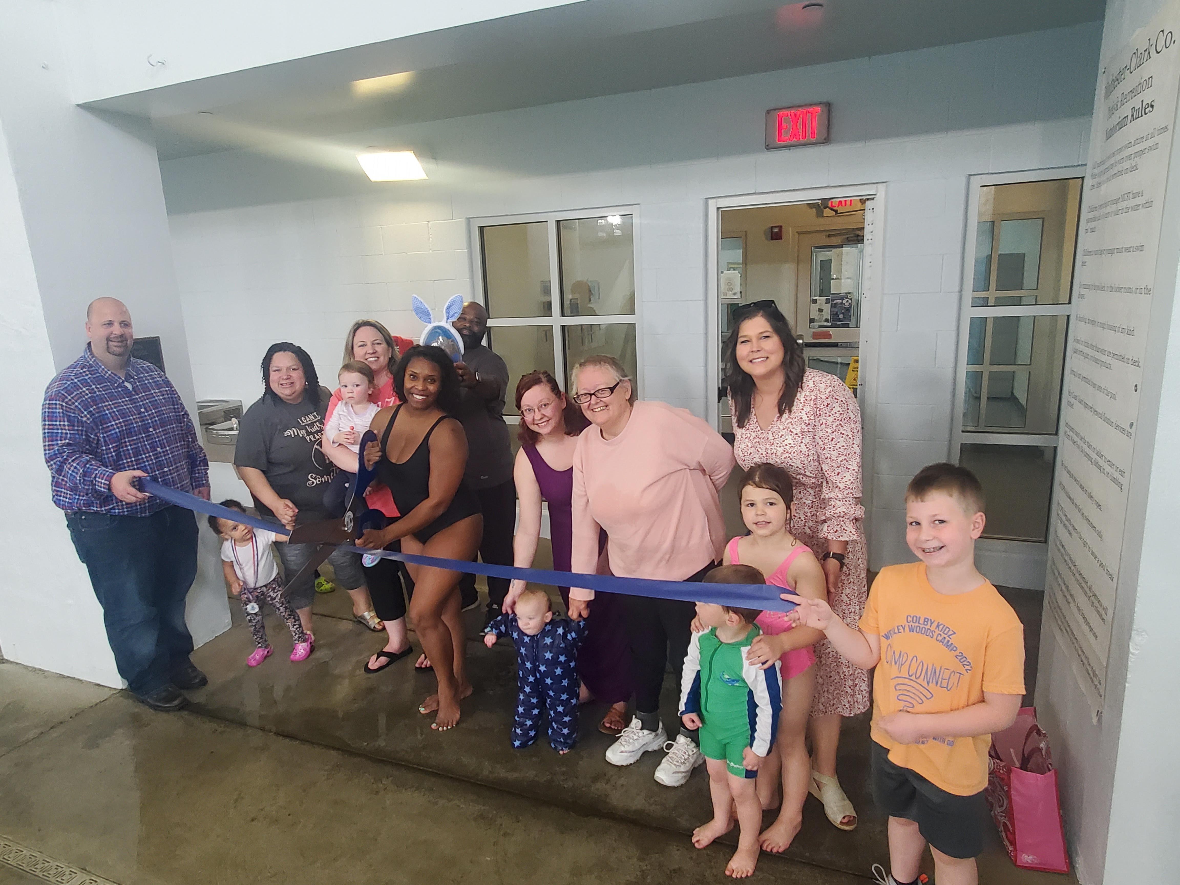 Octavia Cruse cuts the ribbon celebrating ISR (Infant Swim Rescue) with Octavia, LLC membership