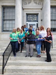 Martha Miller / Clark Circuit Clerk cuts the ribbon celebrating Clark Circuit Clerks Office membership into the Winchester-Clark County Chamber of Commerce.