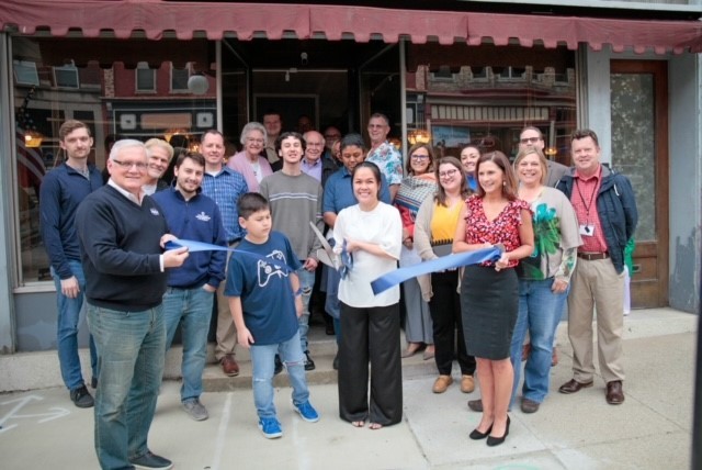 Amy Rouse cuts the ribbon celebrating Amy’s Asian Kitchen membership into the Winchester-Clark County Chamber of Commerce.