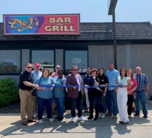Leslie Thomas cuts the ribbon celebrating DJ’s Steakhouse Bar and Grill membership into the Winchester-Clark County Chamber of Commerce.