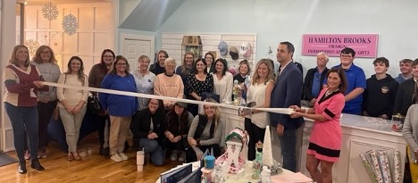 Amanda Adams cuts the ribbon celebrating Hamilton Brooks Design membership into the Winchester-Clark County Chamber of Commerce.