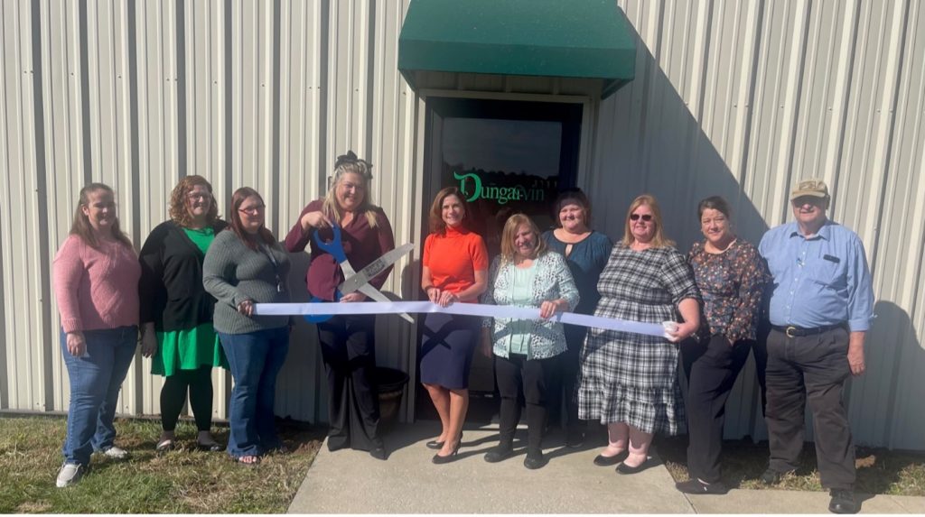 Megan Rhinehimer cuts the ribbon celebrating Dungarvin’s membership into the Winchester-Clark County Chamber of Commerce.