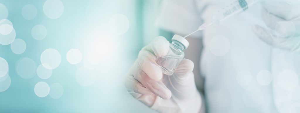 Doctor hand holding syringe  injection to vaccine in glass bottle research,2019 peak coronavirus vaccine COVID-19,concept medicine,health,medical analysis,biochemical,biochemistry test in laboratory