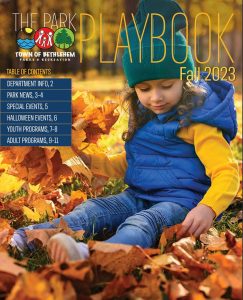 Cover of Bethlehem Parks and Rec Fall Playbook, young girl playing in the leaves
