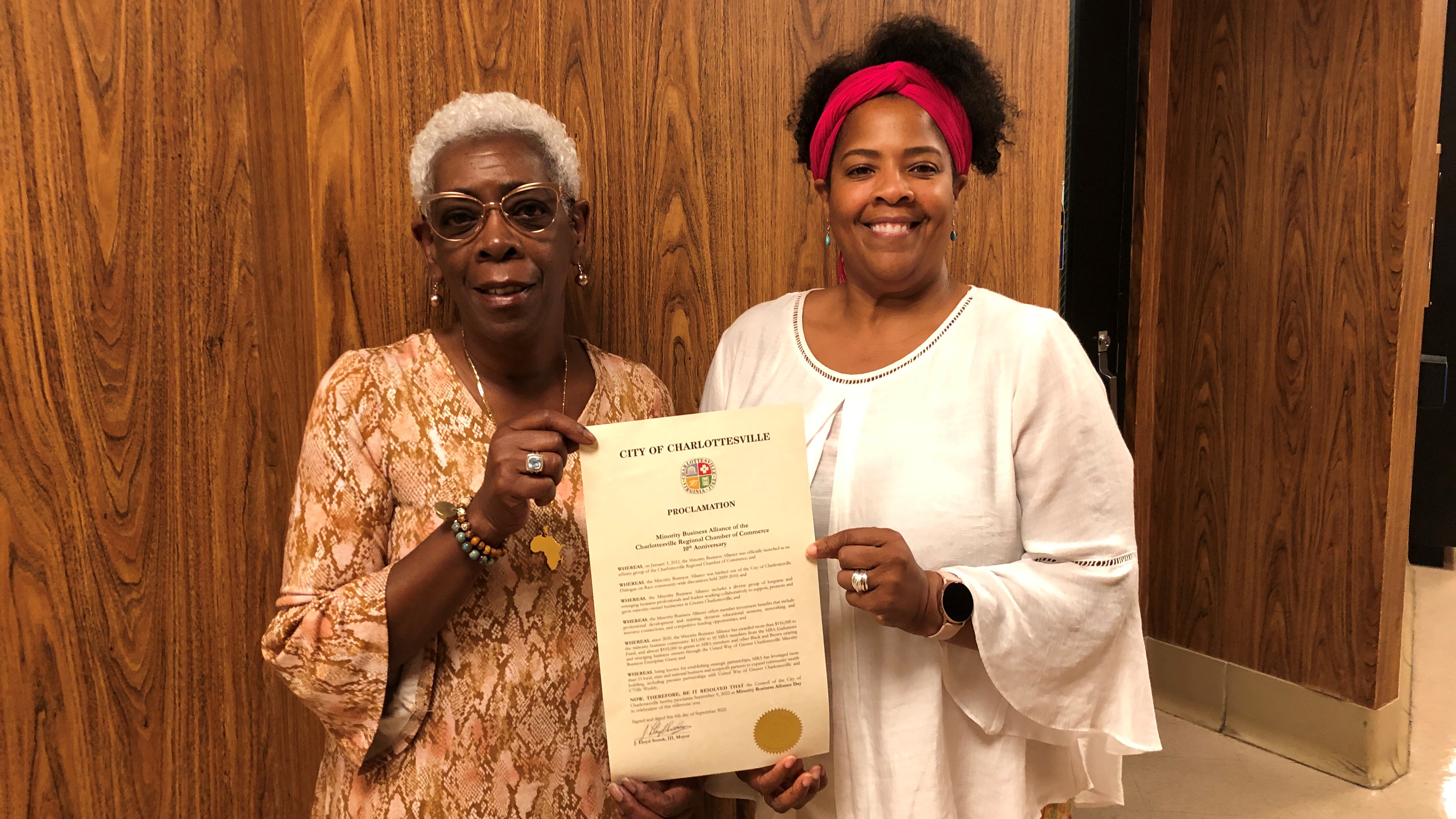 Kaye Monroe and Andrea Copeland hold the MBA Day Proclamation at City Hall