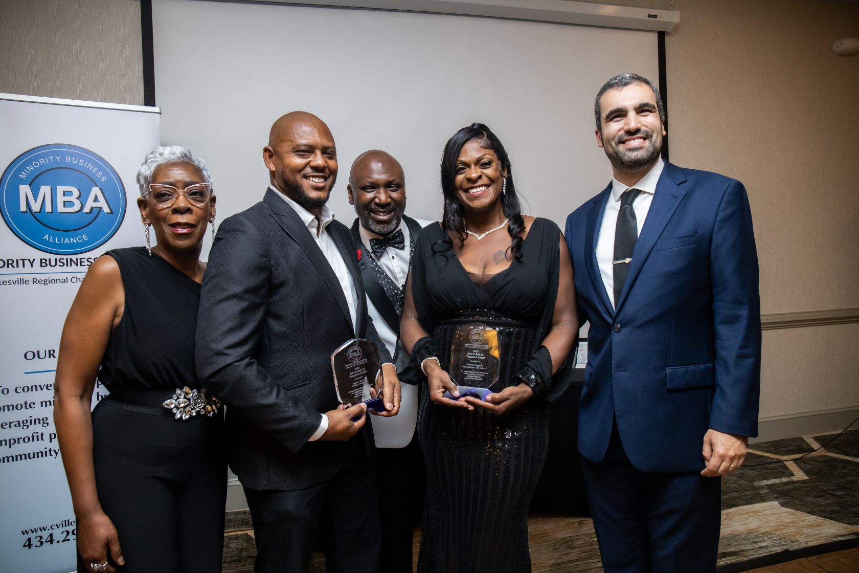 Antwon Brinson and Sabrina Feggans receive the Minority Business Alliance John F. Bell Sr. Vanguard Award