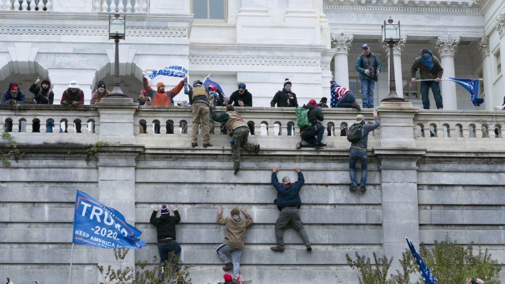 Rioters Climbing Capitol Hill Wall