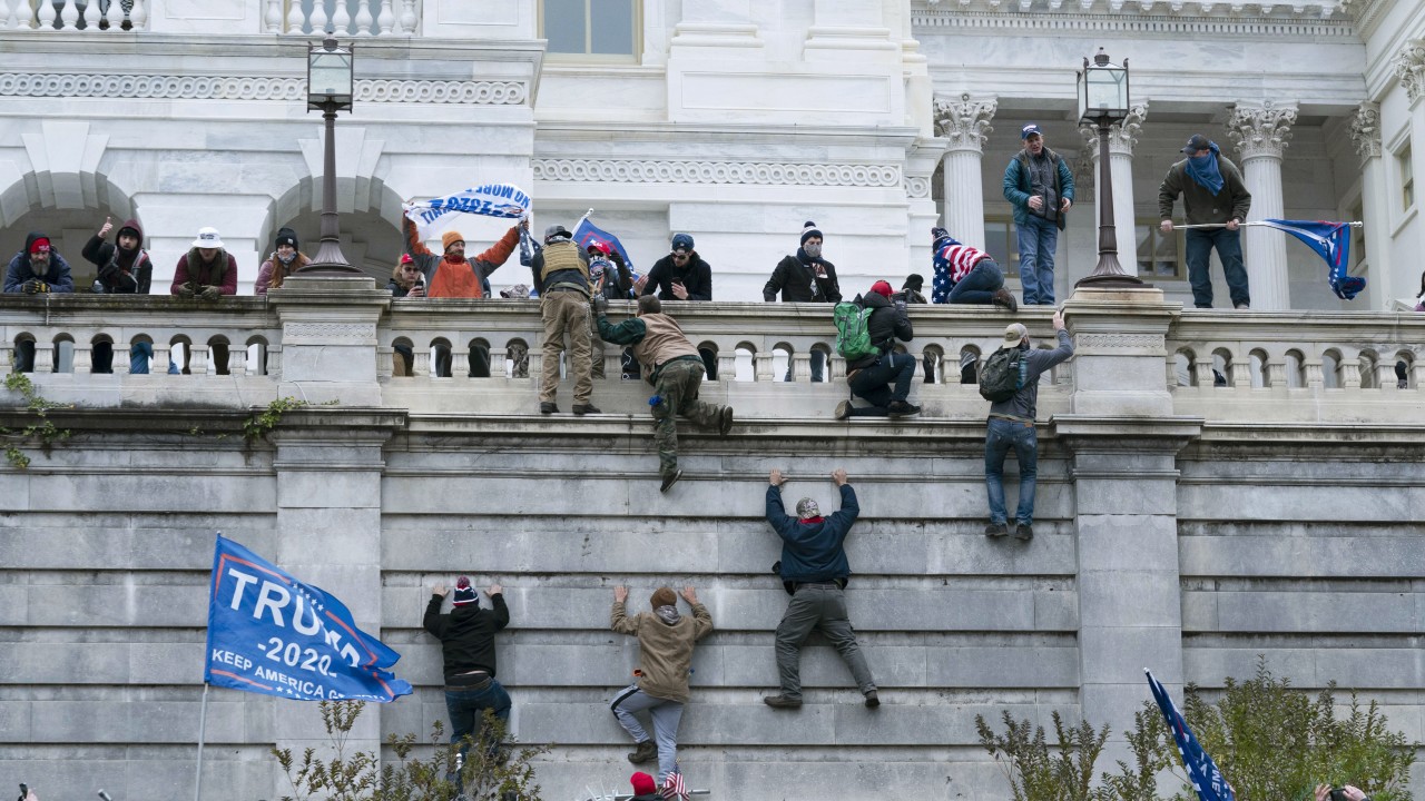 Rioters Climbing Capitol Hill Wall