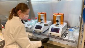 Biomedical Technician working at lab equipment