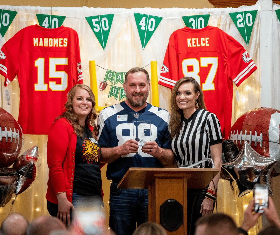 Troy Sculley accepting Business of the Year Award for Ken's Garage