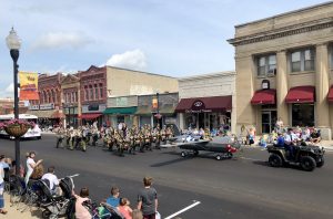 Drumline marching east on Main Street in Pipestone's Historic Downtown District.