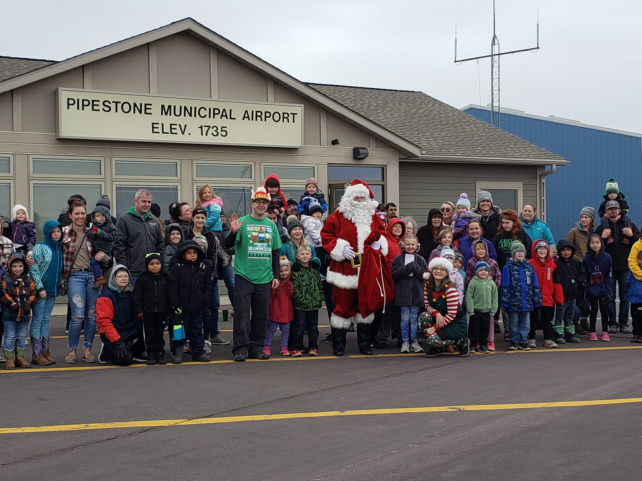 Santa Clas in front of the terminal at Pipestone Municipal Airport
