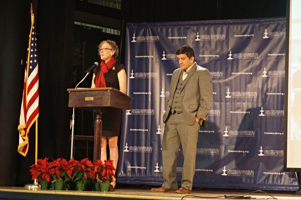 Mike Kalathas receiving the award from Kim Crider