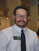 photo of Damon Hunneman, man with tie and glasses