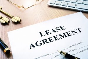 Rental lease agreement form on an office desk.