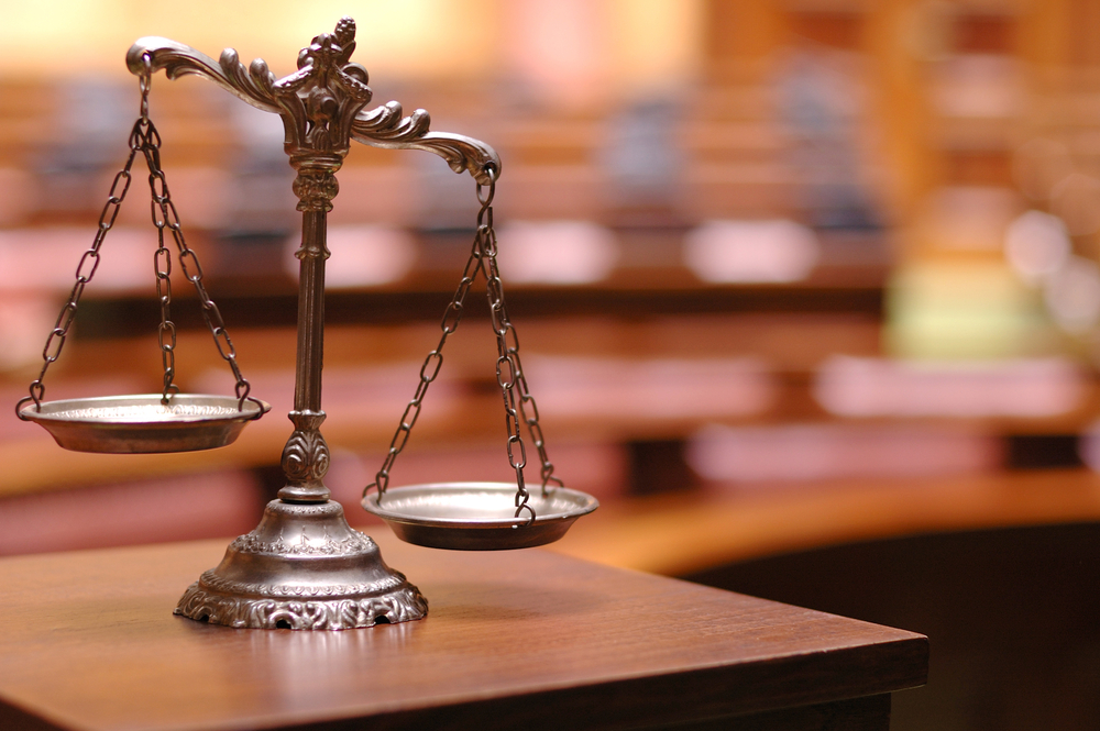 Decorative Scales of Justice in the Courtroom crime rate prop 47 57