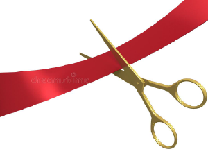 Scissors cutting a red ribbon