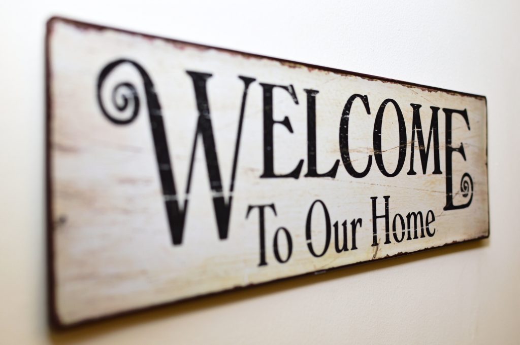 A sign that says "Welcome To Our Home."