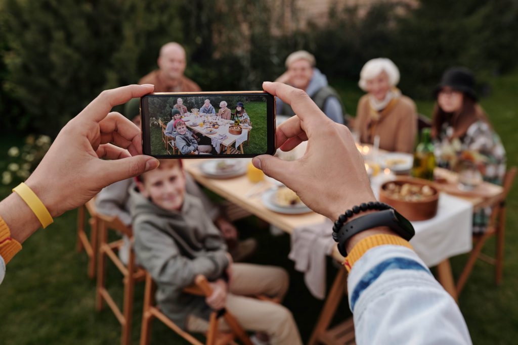 A camera taking a picture of a multigenerational family