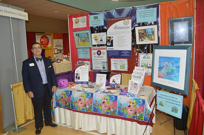 Tom Cox, iSolutions Insurance Advisors proudly displays his Expo booth at the annual EMCCC Business Expo.