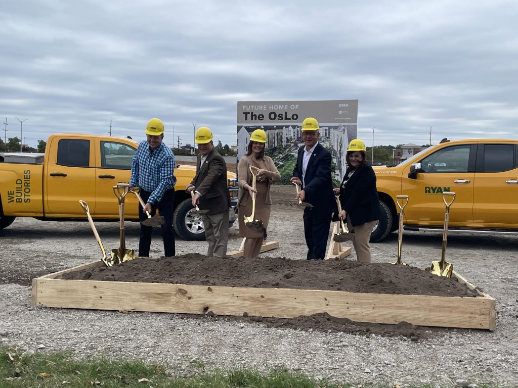 Officials breaking ground on October 12, 2023. Pictured are Brandon Brensing (Ryan), Tracey Osborne Oltjen (OP Chamber), Curt Skoog (Mayor of Overland Park), Matt Massanolisis (Planning Commission), Paul Lyons (OP City Council), Lori Luther (City of Overland Park) 