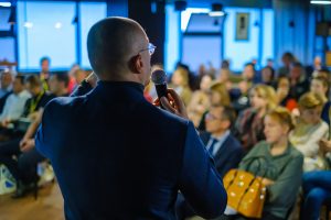 Male presenter speaks to audiences at workshop