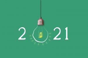 Steer Brand into 2021. Light Bulb On A Green Background.