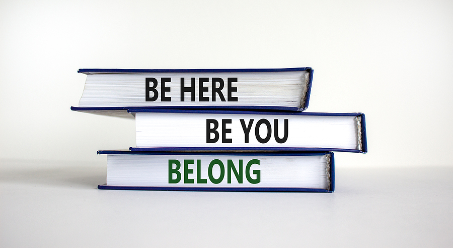 Books With Words 'be Here, Be You, Belong' On Bea