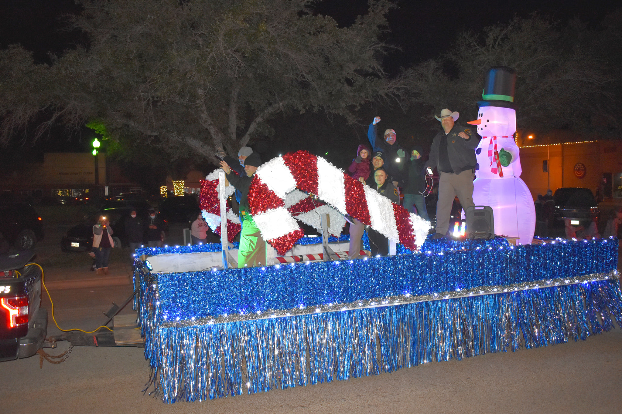2nd Place - Milam County Sheriff's Dept This 2020 Sheriff David Greene's Milam County Brown Santa Float was seen in the 1947 Miracle on 34th Street. If you look closely you can make out the exact details in the scene where John Payne and Natalie Wood sit talking as the Macy's Parade travels by in the background.