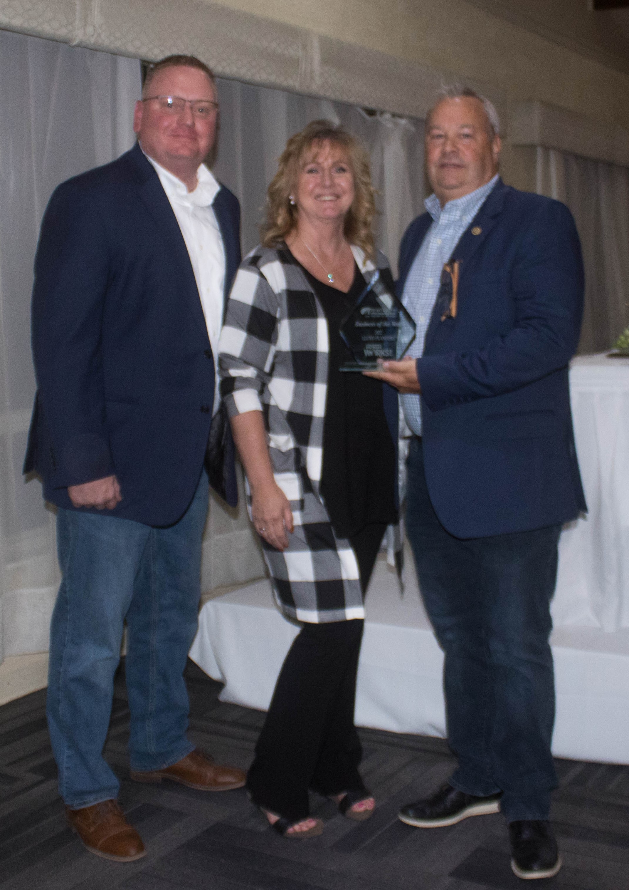 Upper Peninsula Michigan Works Business-of-the-Year: Lloyd Flanders Indusctries Inc. 
L to R: Derek Butler, Operations Manager, Lloyd Flanders; Jeanne Albert, Michigan Works!; Warren Juliano, President, Lloyd Flanders