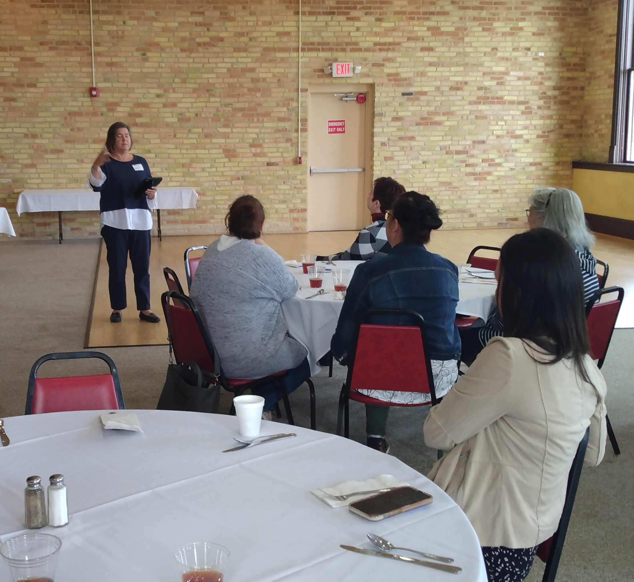 Gloria Anderson speaking to attendees