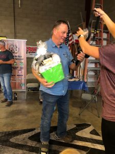 Photo of Dan Gerling, Co-owner of Express Type & Graphics accepting raffle prize at the October 2020 Mixer hosted by Galt Sign