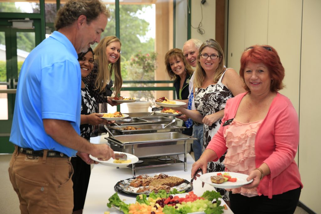 Wake_up_paso_serving_breakfast people getting breakfast at wake up paso event