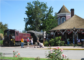 Depot historic depot exterior with train on tracks