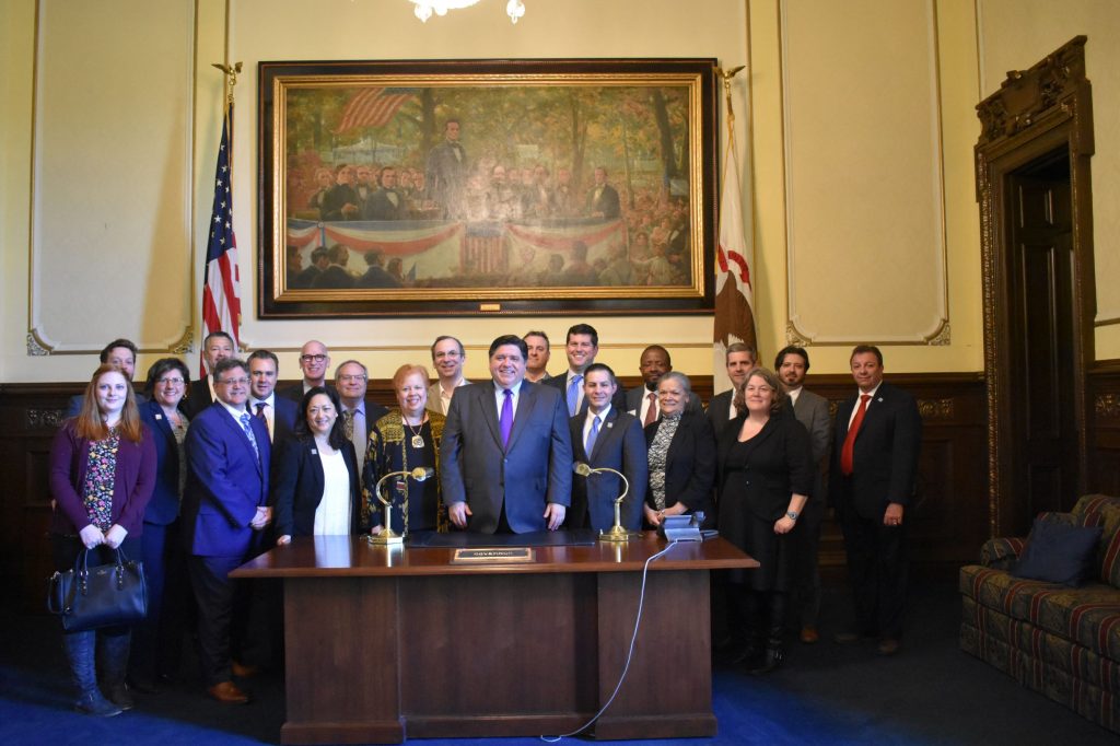 The SBAC team pictured with IL. Governor J.B Pritzker