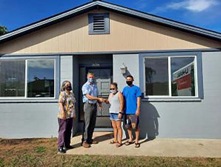 Realtors Association of Maui member and Na Hale O Maui executive director Cassandra Abdul, Na Hale O Maui board president David Ward and new happy homeowners Jamie Potter-Kekiwi and Jefferson Hatanaka. Na Hale O Maui is a volunteer- and membership-based organization that puts affordable homeownership within reach of Maui County residents by securing and preserving a permanent supply of affordable housing alternatives.